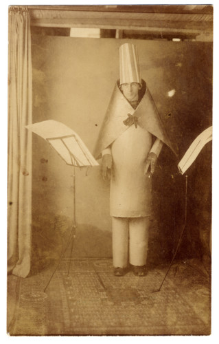 old photo of man standing in room
