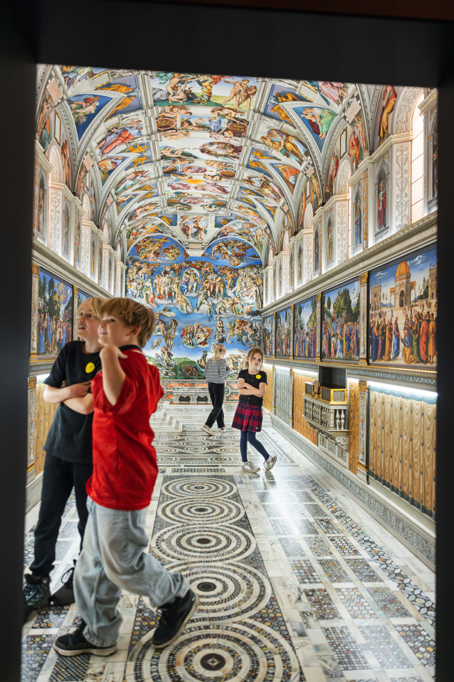 children inside artwork looking like miniature of church